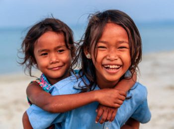 Cambodian little girls playing on the beach, Cambodia